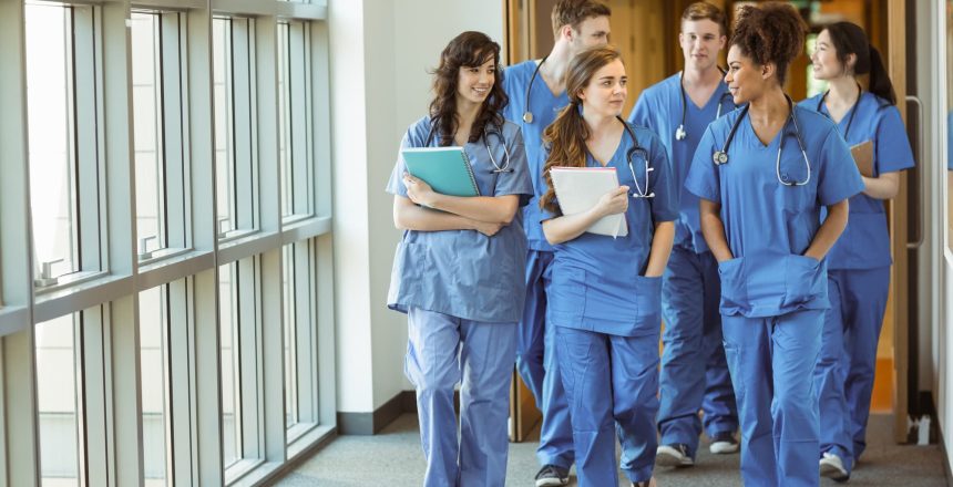 Medical students walking through corridor at the university